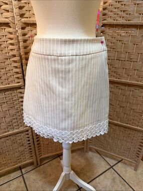 Attyre Cream Pinstripe Mini Skirt with Circular Eyelet Hem